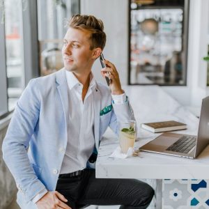 Employee looking out window on a call holding a phone